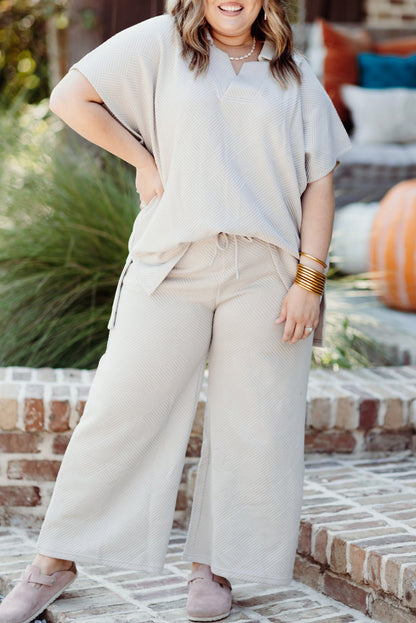 Chic beige plus size textured top and pants ensemble