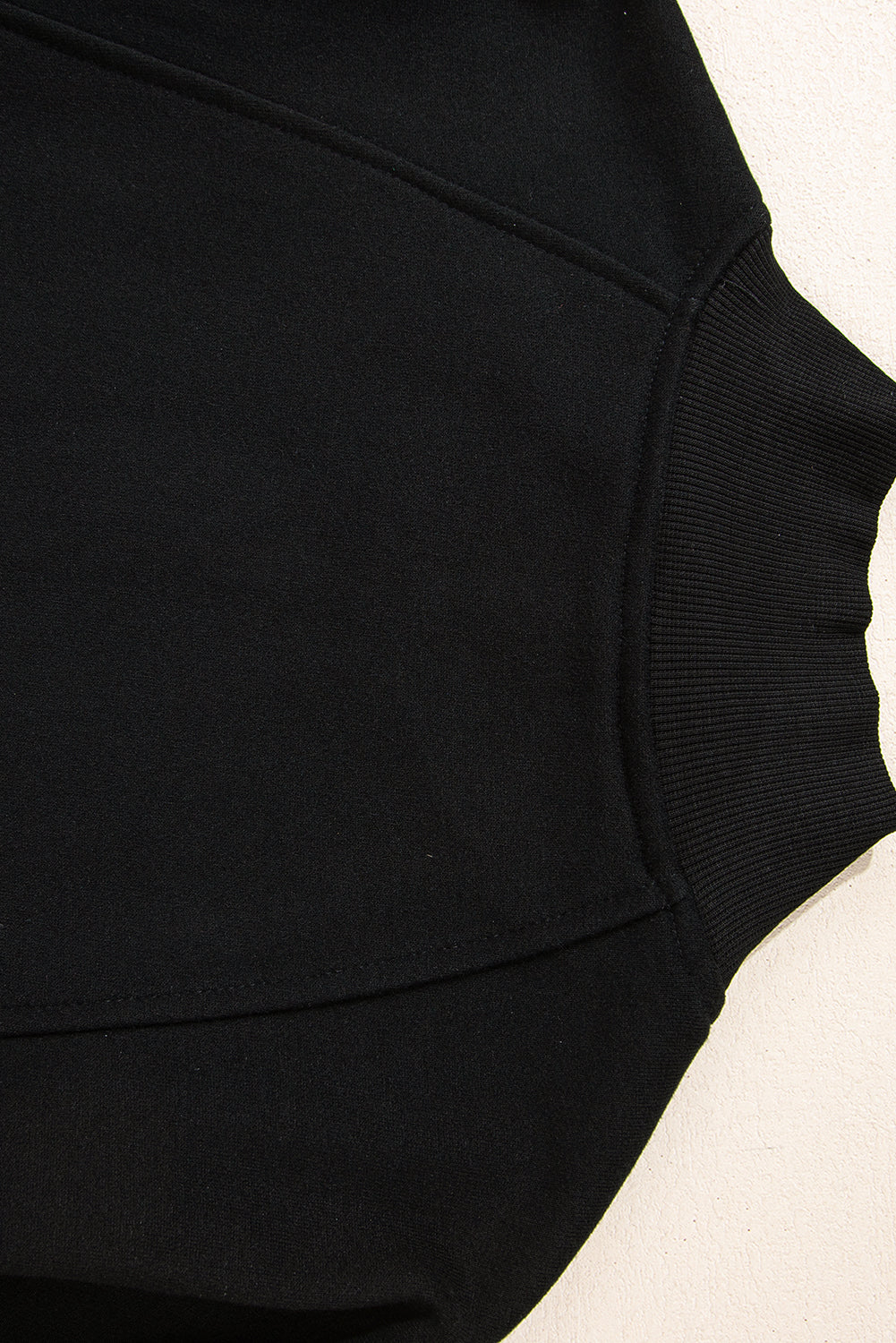 Chic black zip-neck sweatshirt with drop shoulder design