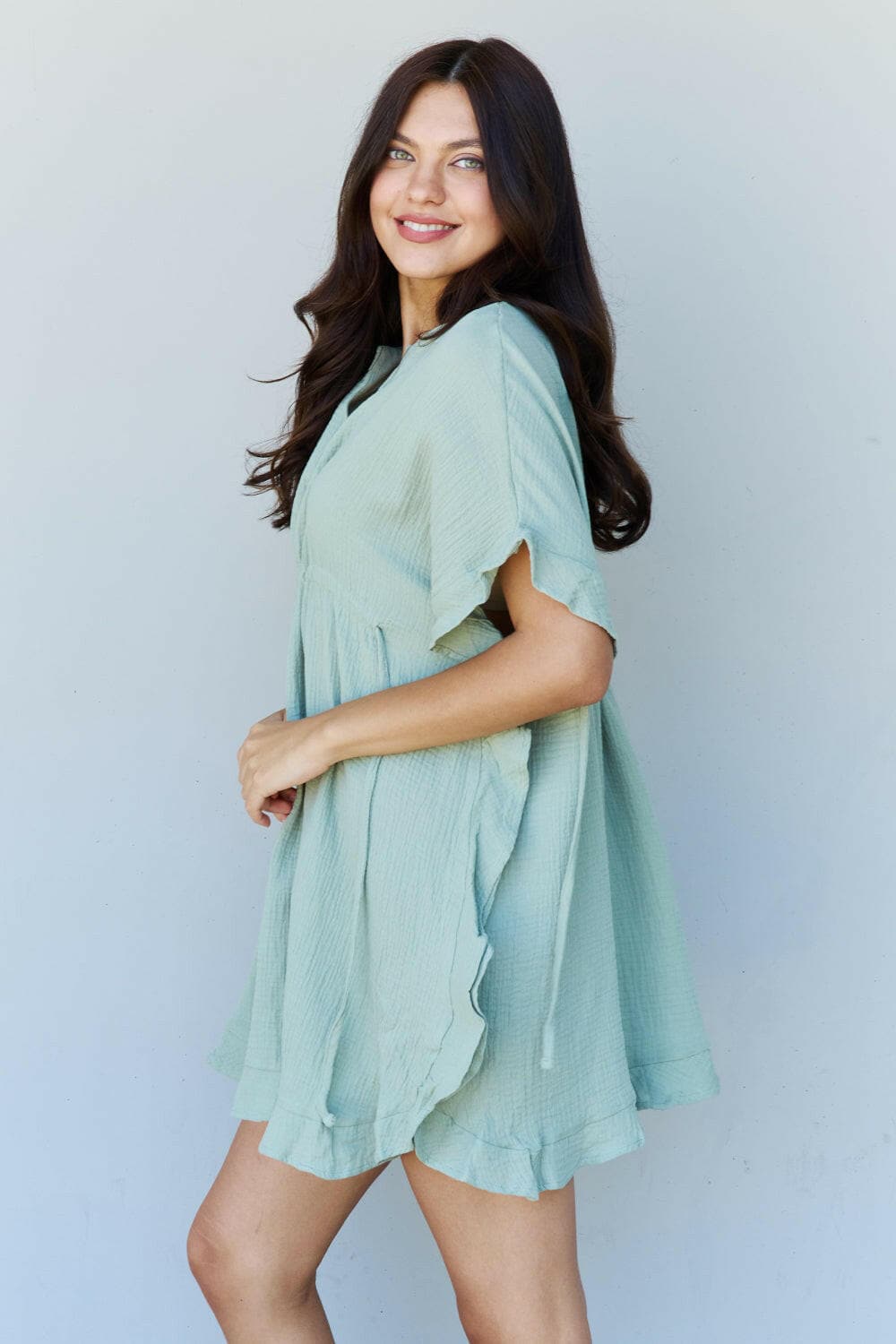 Ninexis Out Of Time Full Size Ruffle Hem Dress with Drawstring WaistbaExperience Effortless Elegance with the Ninexis Out Of Time Full Size Ruffle Hem Dress in Light Sage. This stunning dress is crafted from 100% cotton, providing a soLove Salve Time Full Size Ruffle Hem DressTIKTOK