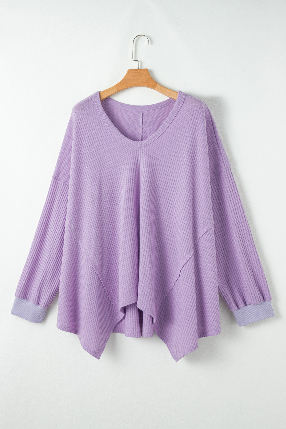 Flattering orchid petal plus size waffle knit top with exposed seams