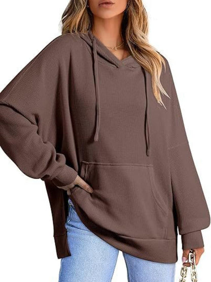 Sleek pocketed hoodie with drawstring and side slit