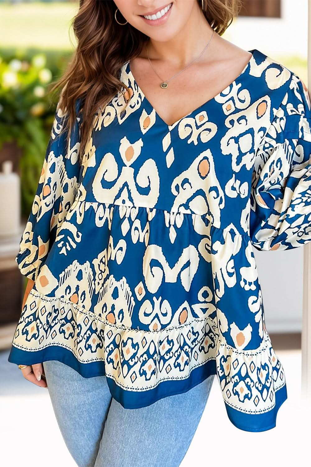 Floral print V-neck blouse with three-quarter sleeves