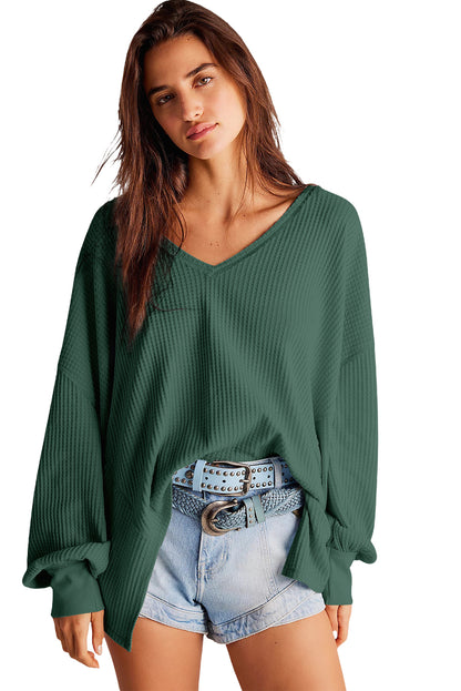 Chic blackish green waffle knit V-neck long sleeve blouse with drop shoulders