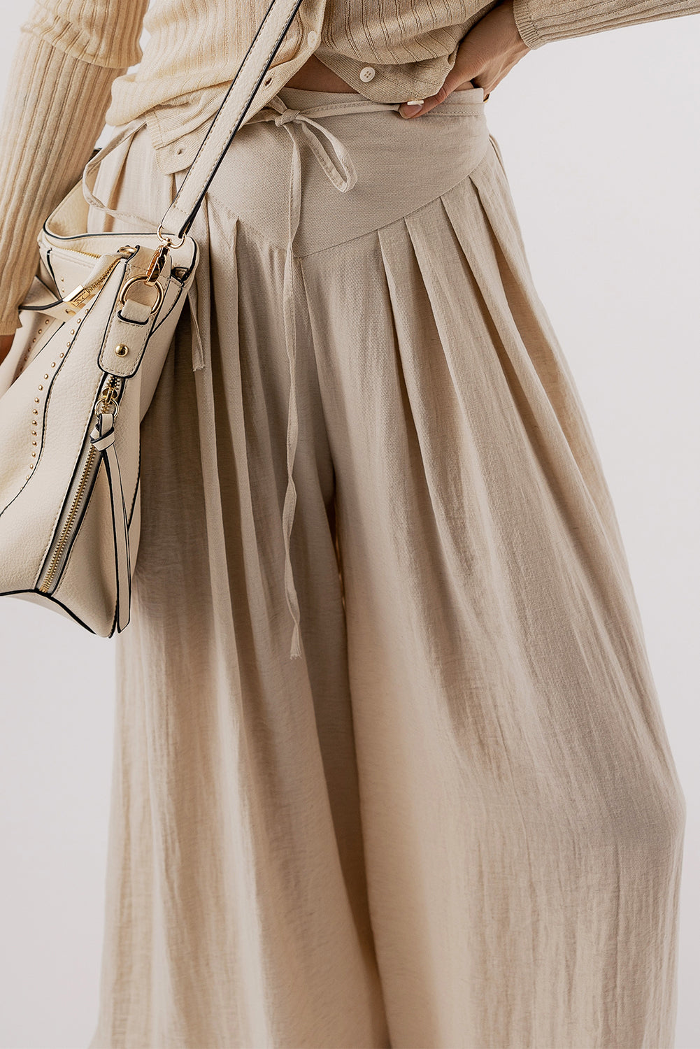 Beige high-waisted wide-leg trousers