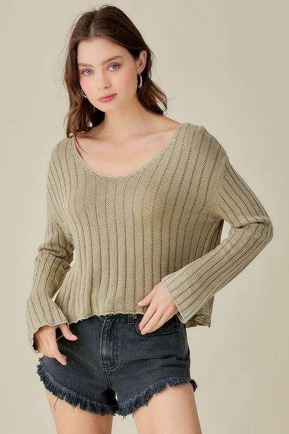 Relaxed V-neck cropped sweater with a vintage wash