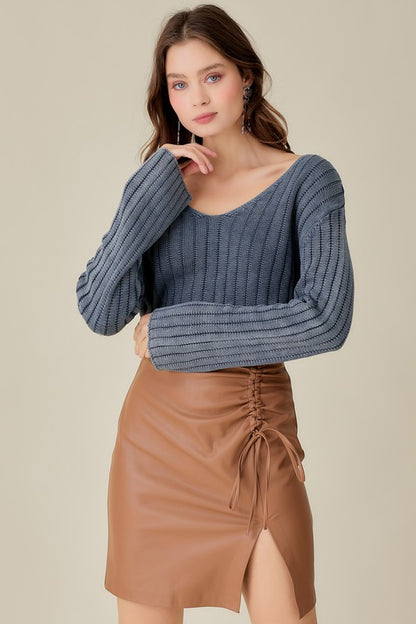 Relaxed V-neck cropped sweater with a vintage wash