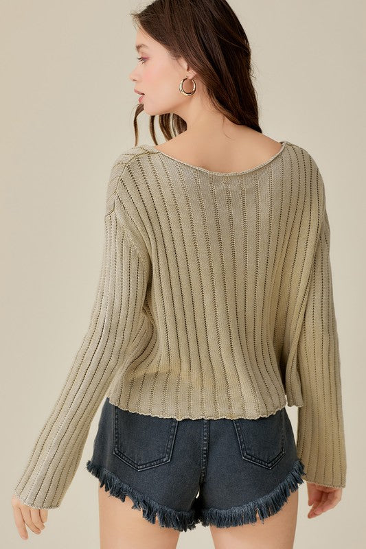 Relaxed V-neck cropped sweater with a vintage wash