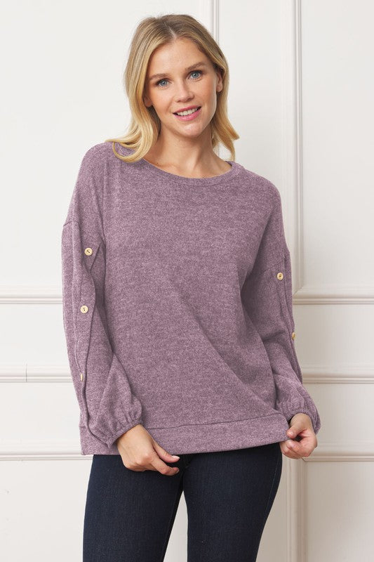 Stylish drop shoulder top with button sleeve accents