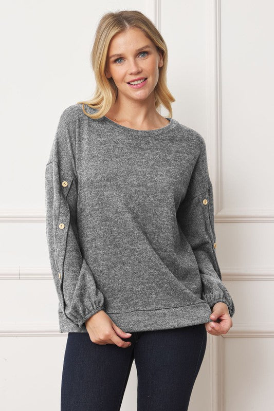 Stylish drop shoulder top with button sleeve accents