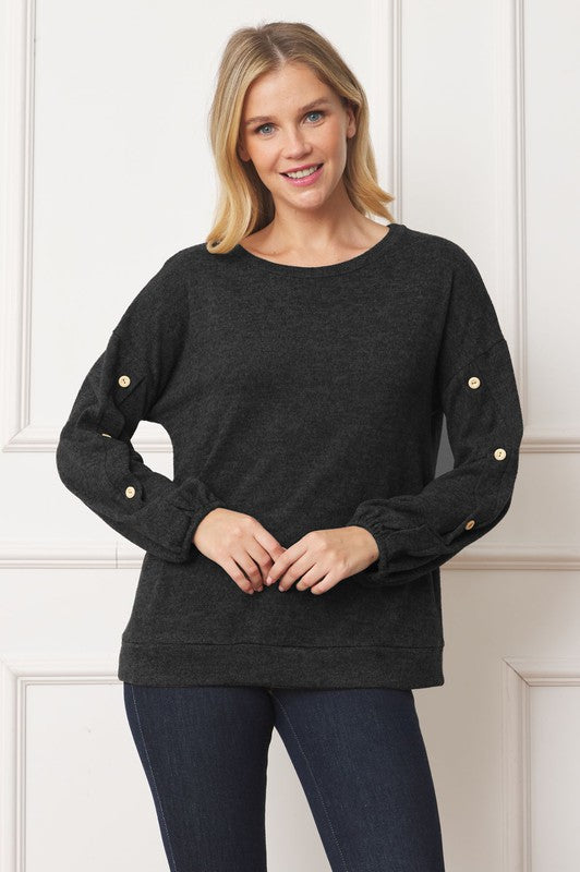 Stylish drop shoulder top with button sleeve accents