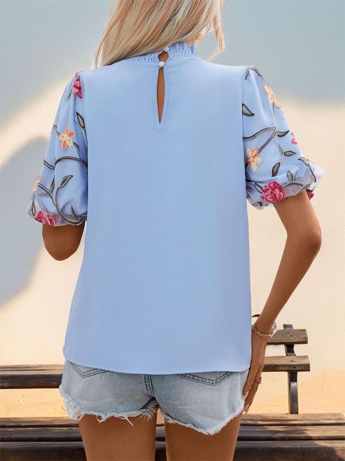 Embroidered Mock Neck Puff Sleeve Blouse.