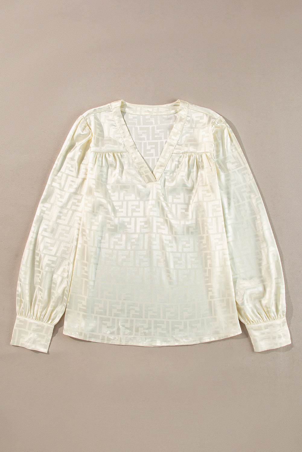 Chic oatmeal jacquard blouse with v-neck and bishop sleeves