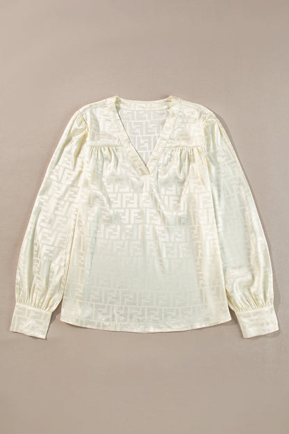 Chic oatmeal jacquard blouse with v-neck and bishop sleeves