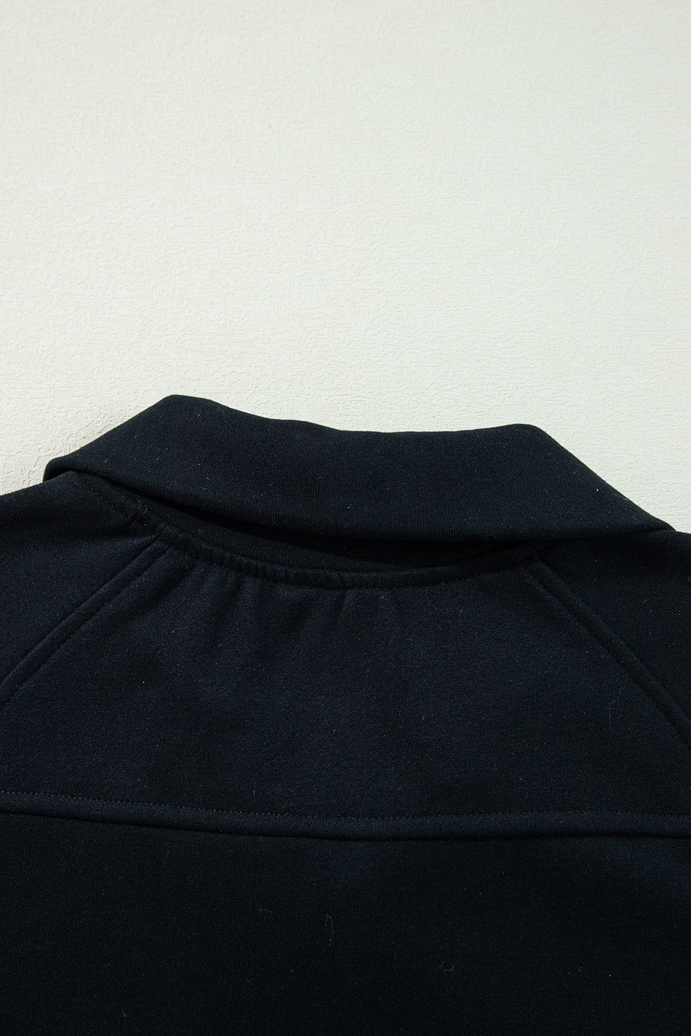 Chic black quarter zip sweatshirt with kangaroo pocket