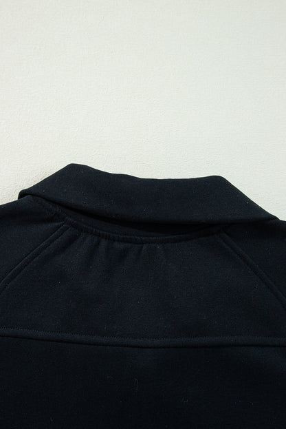 Chic black quarter zip sweatshirt with kangaroo pocket