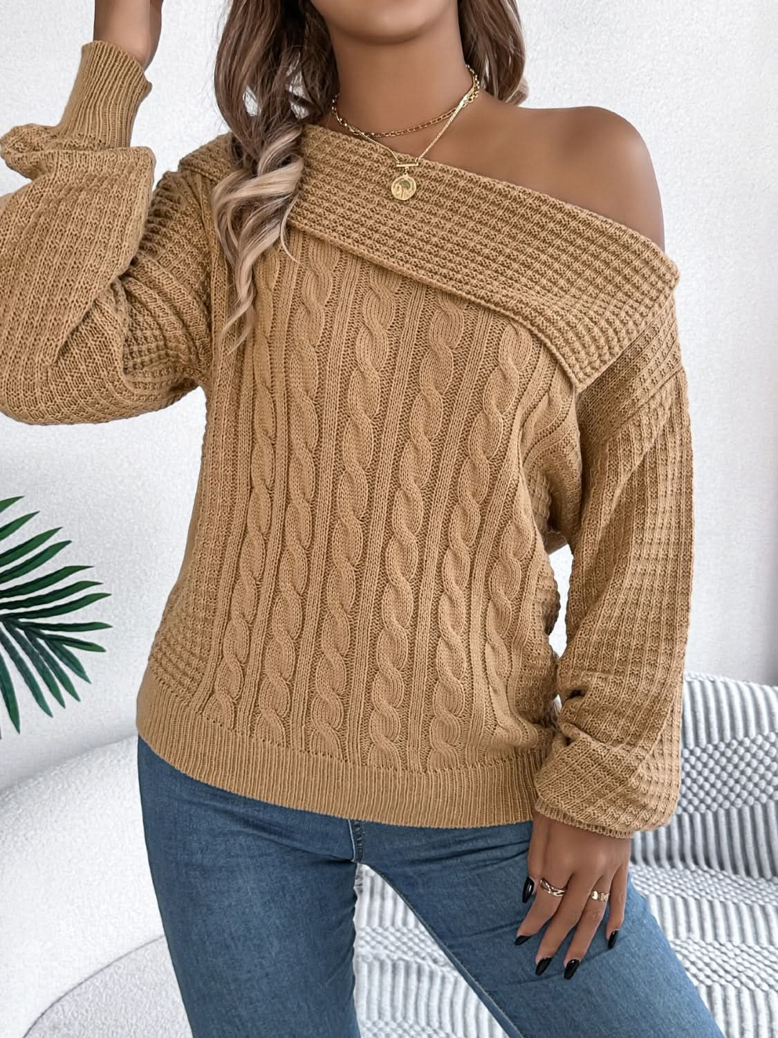 Asymmetrical cable-knit long sleeve sweater