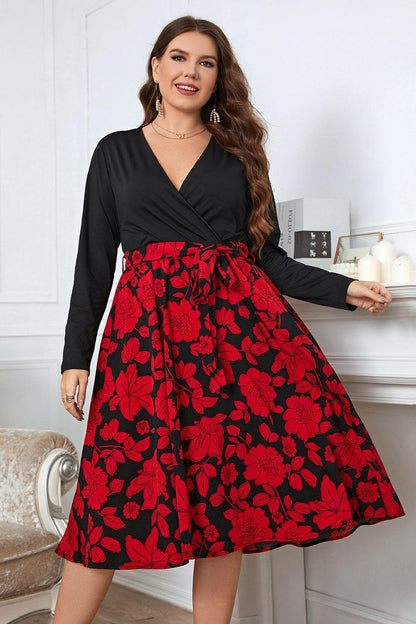 Plus size floral surplice neck long sleeve dress with tied sheer detail and breathable design.