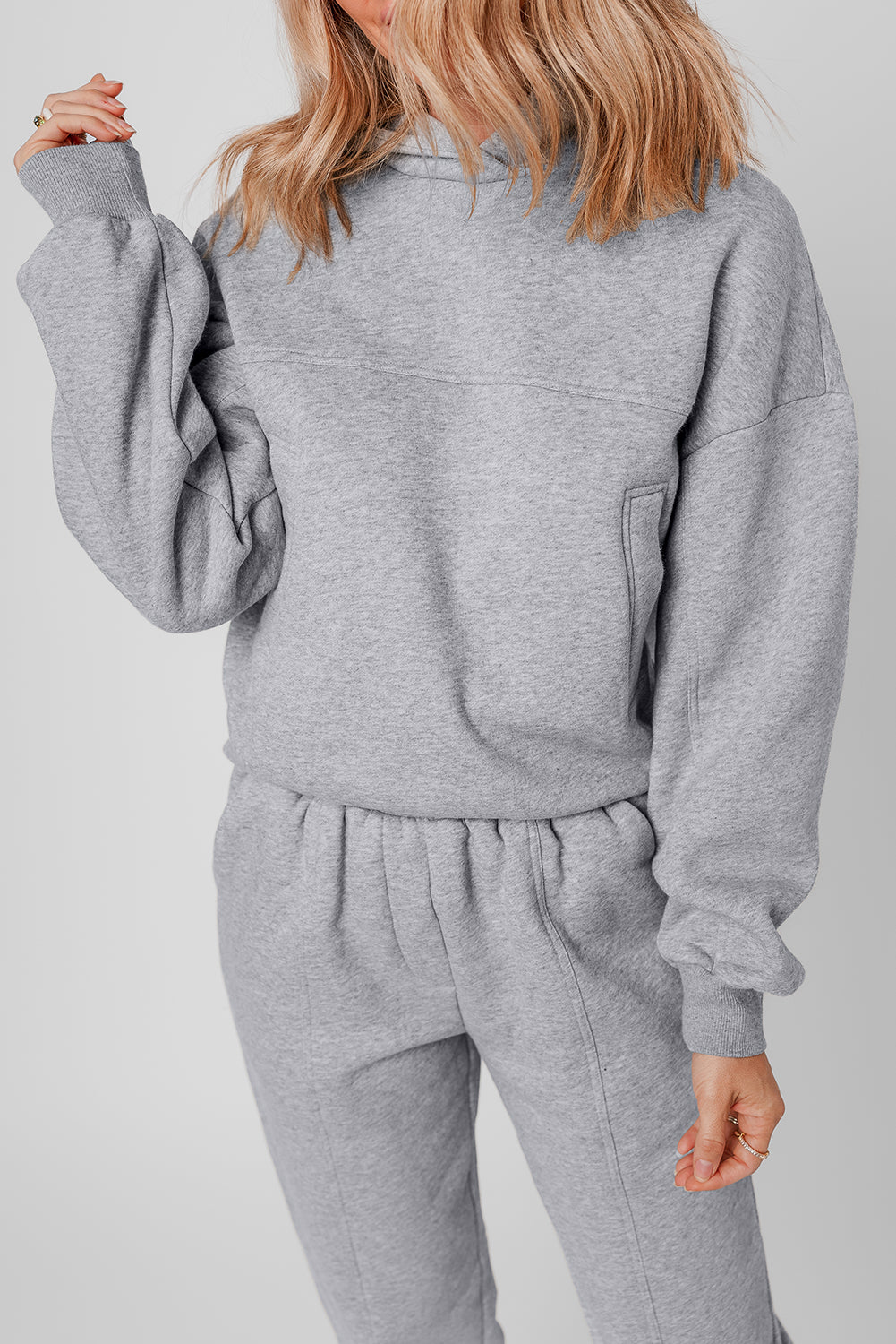 Stylish gray hoodie and joggers set with exposed seams