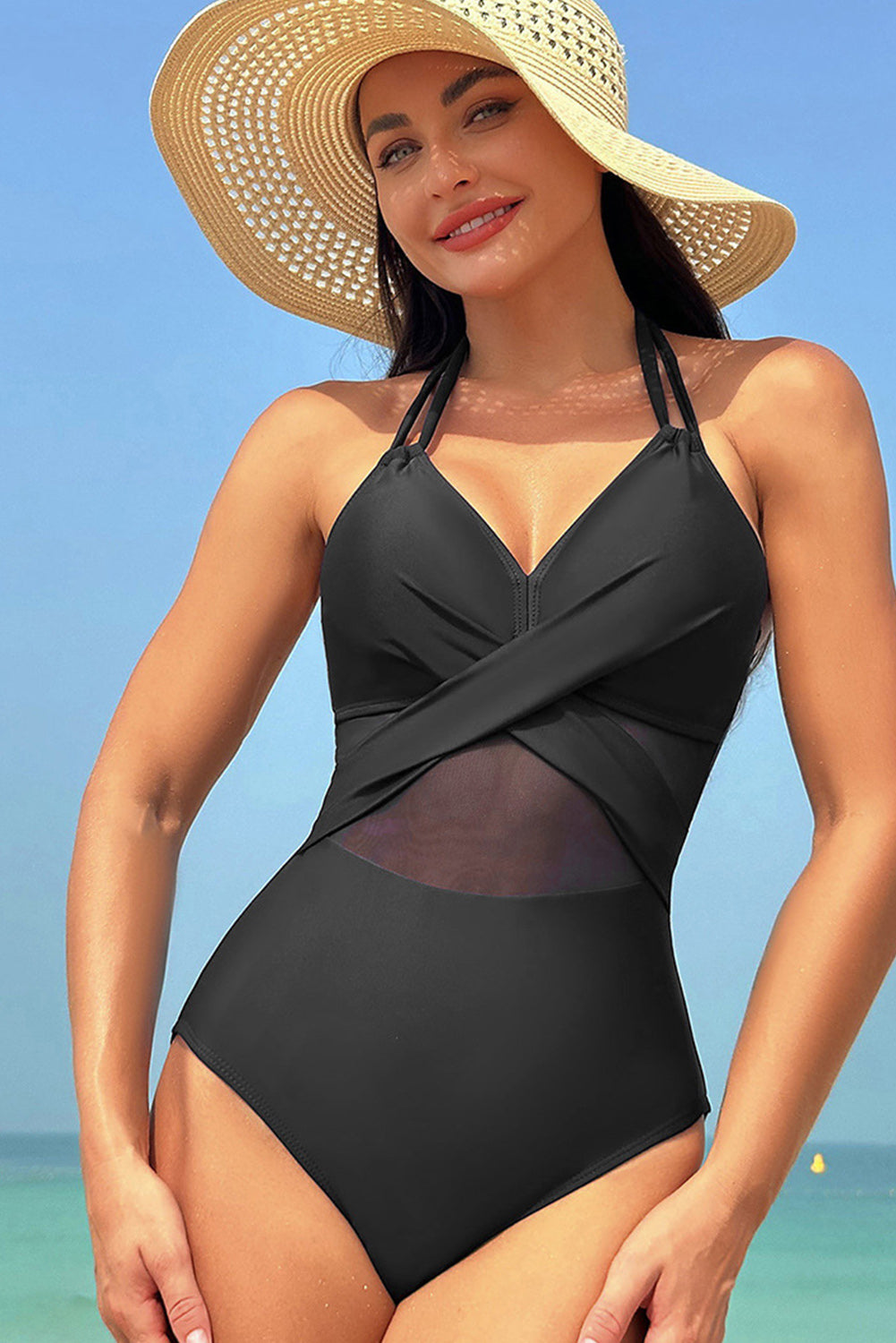 Elegant black halter one-piece swimsuit with mesh inserts