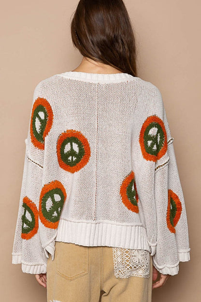 V-neck long sleeve sweater with peace pattern