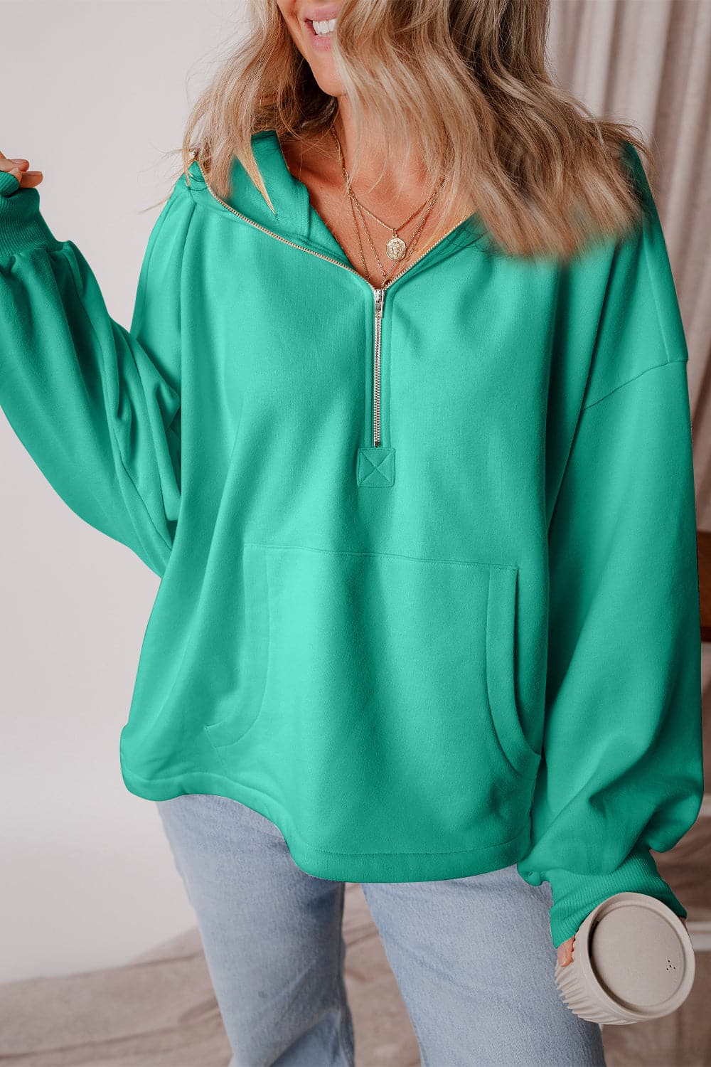 Pocketed Half Zip Dropped Shoulder Hoodie.