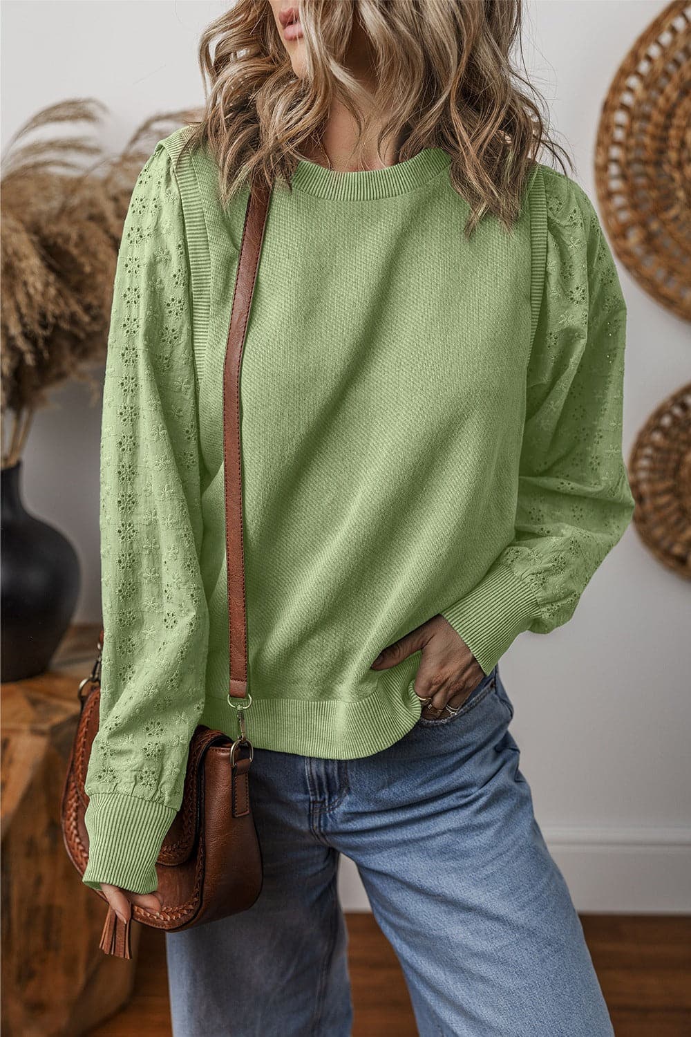 Eyelet Round Neck Long Sleeve Sweatshirt.