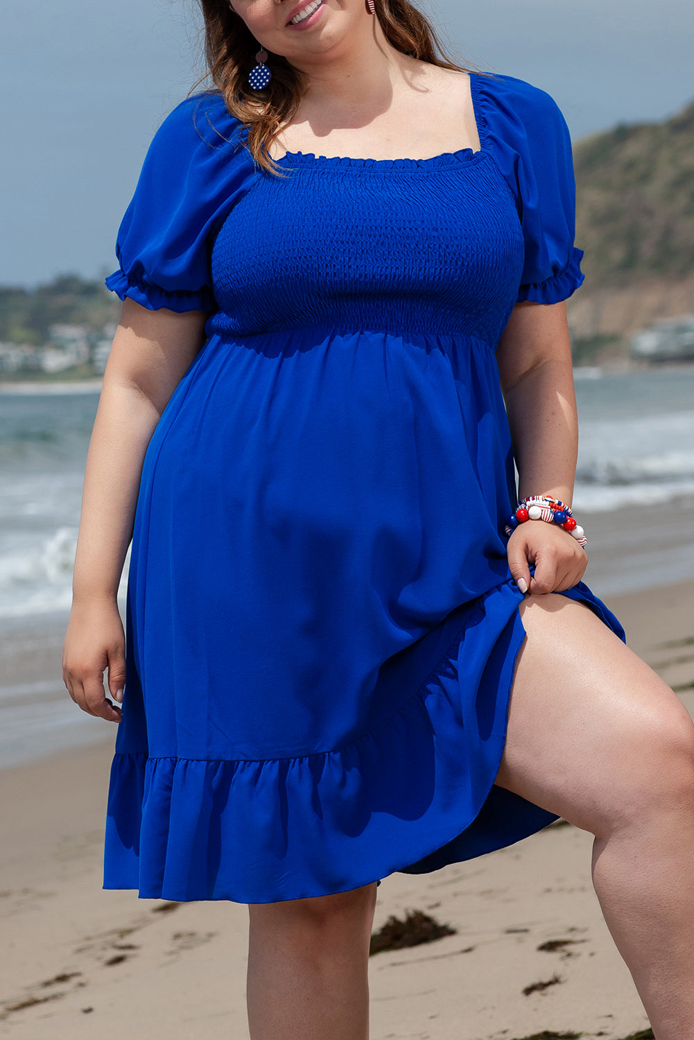 Flattering dark blue ruffled mini dress with square neckline for plus sizes