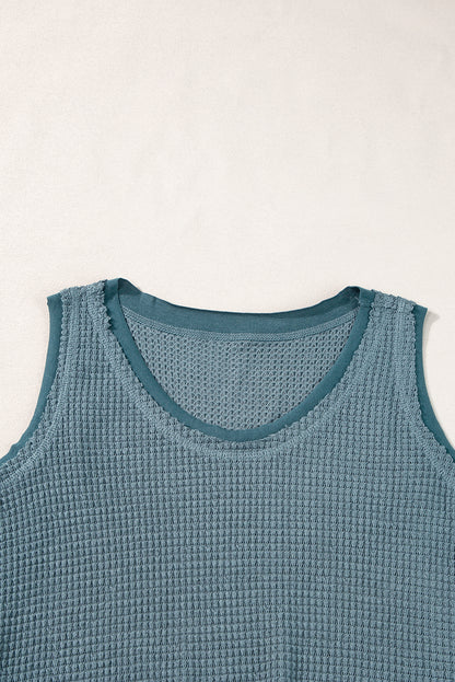 Teal flowy vest with scoop neckline and waffle knit texture