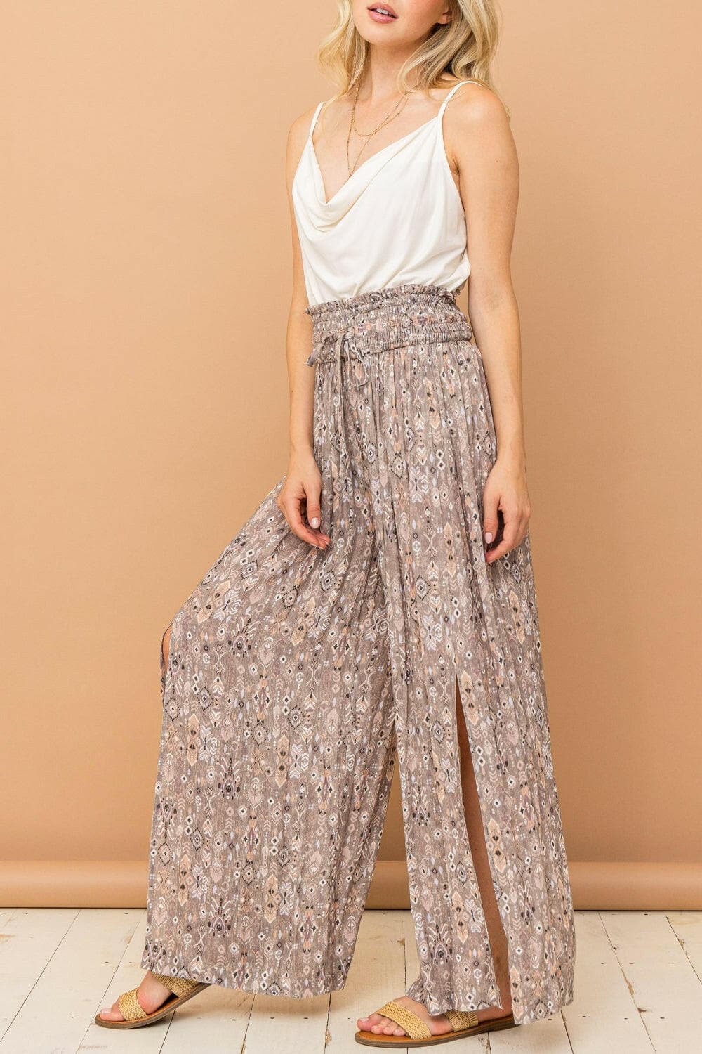 And The Why Printed Smocked Waist Slit Wide Leg PantsUpgrade Your Wardrobe with Style and Comfort
 The And The Why Printed Smocked Waist Slit Wide Leg Pants are a must-have addition to your fashion collection. These paLove Salve Printed Smocked Waist Slit Wide Leg Pantsusa