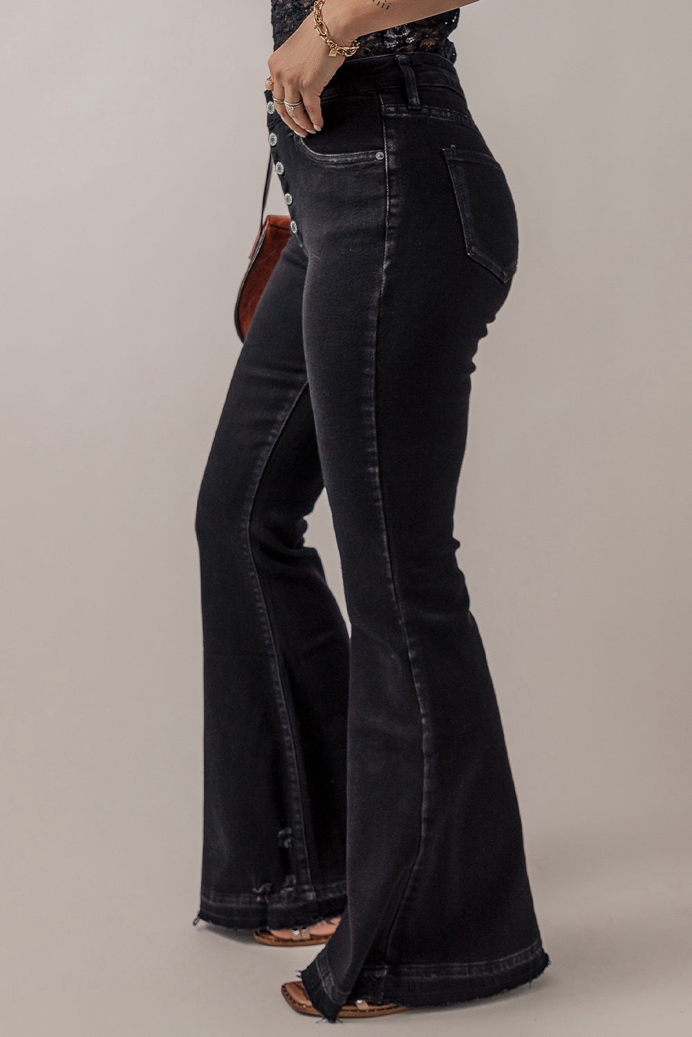 Chic black high-rise flared jeans with retro button front