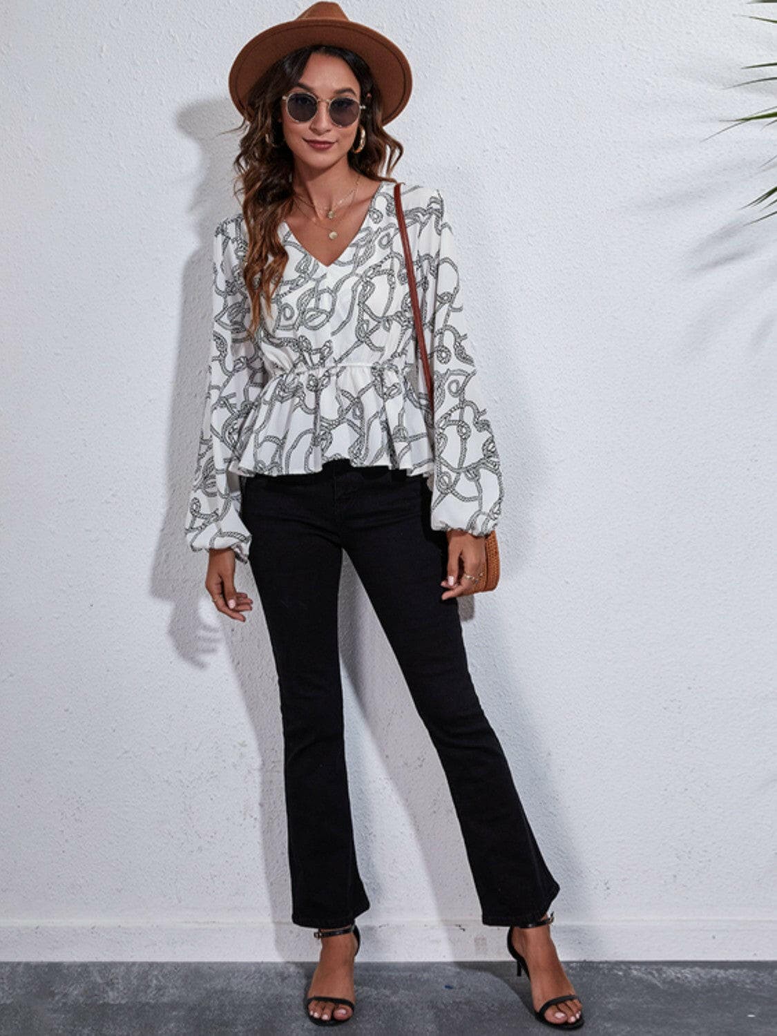 Printed V-Neck Balloon Sleeve Peplum BlousePrinted V-Neck Balloon Sleeve Peplum Blouse
 Introducing our Printed V-Neck Balloon Sleeve Peplum Blouse, a versatile addition to your wardrobe that effortlessly comLove Salve -Neck Balloon Sleeve Peplum BlouseBlouses