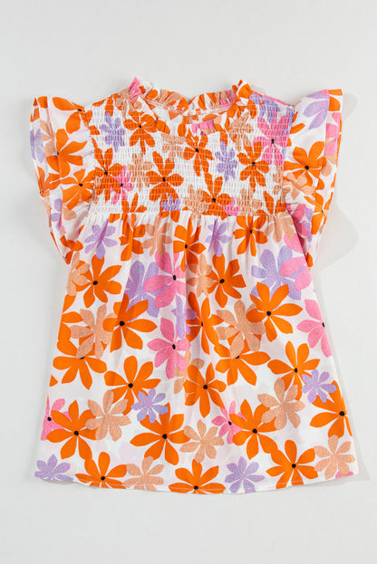 Floral delight: Orange ruffled sleeve top with smocked detail