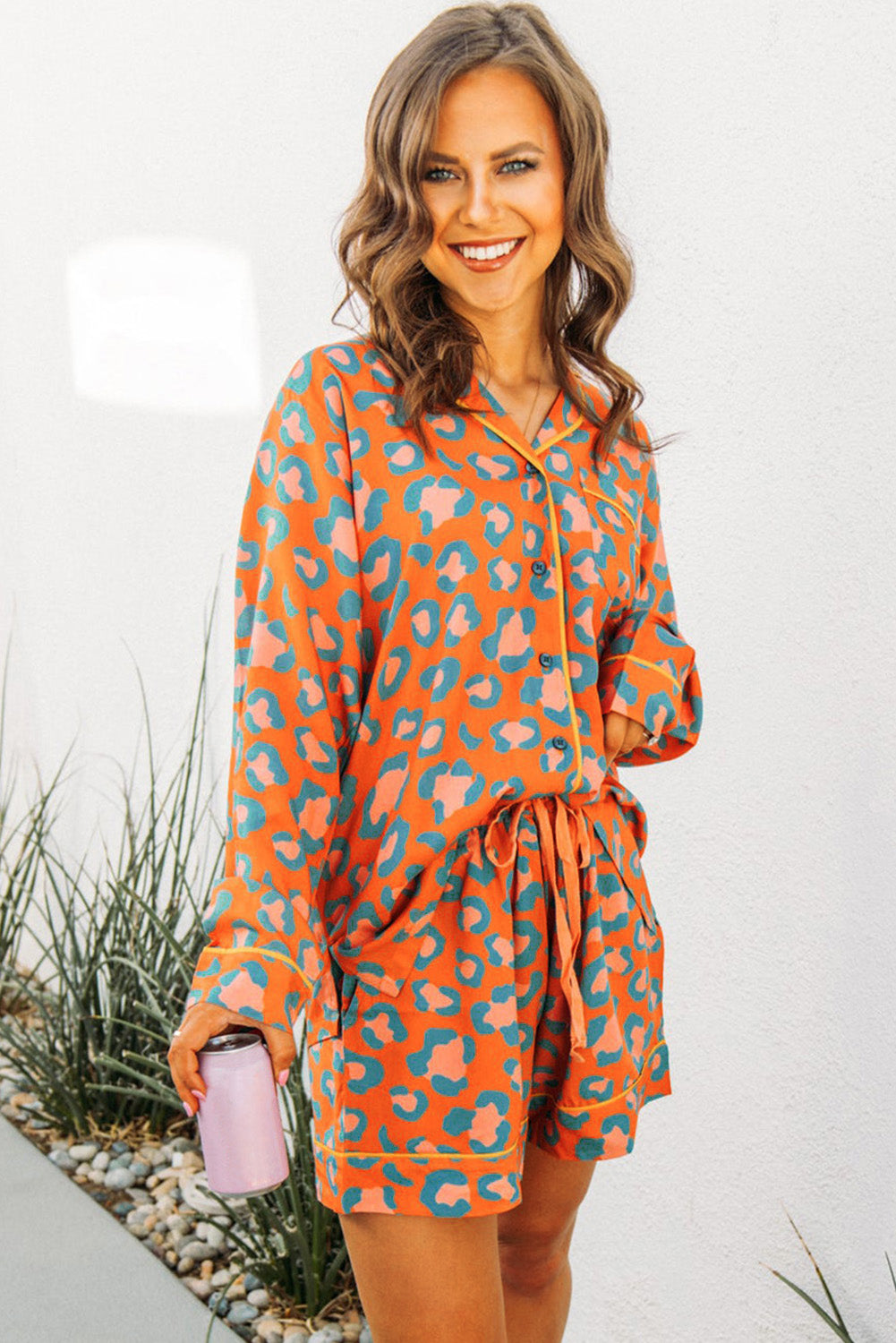 Leopard print loungewear set with long sleeves and shorts in vibrant orange