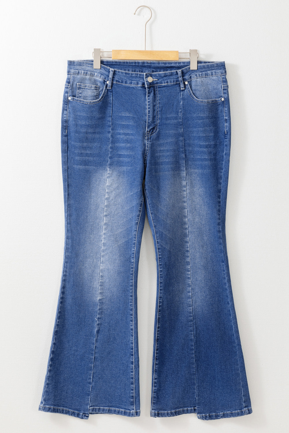 Stylish blue high-waist plus size flare jeans with exposed seam detail