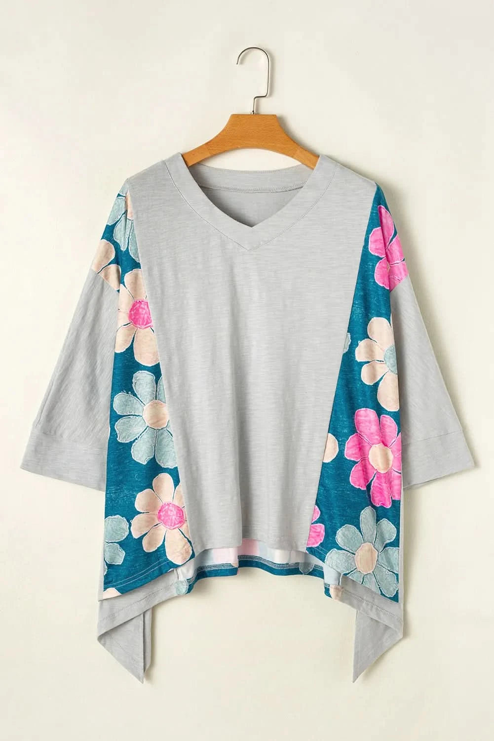 Floral V-neck blouse with three-quarter sleeves and high-low hem