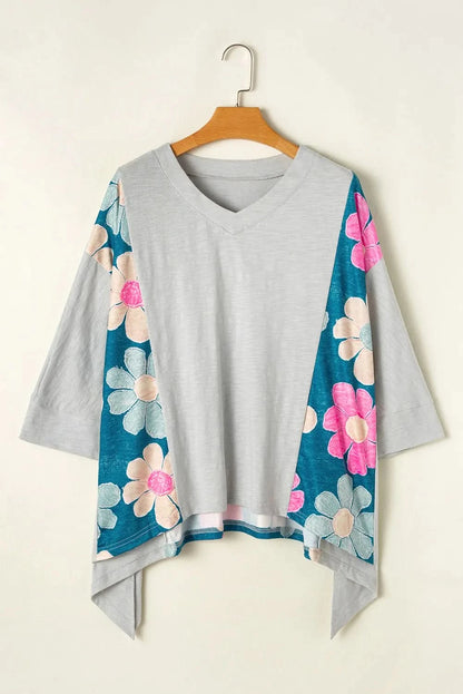 Floral V-neck blouse with three-quarter sleeves and high-low hem