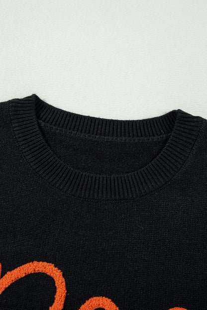 Cozy black "Boo" knitted sweater with ribbed edges for casual style