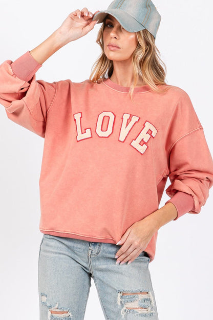 Love-inspired drop shoulder sweatshirt with playful applique details