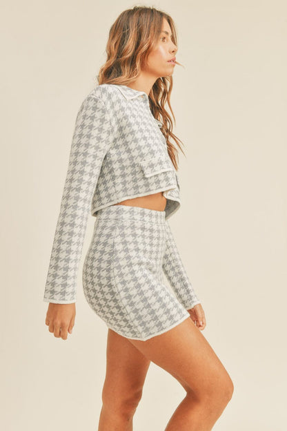 Chic houndstooth knit cardigan and mini skirt ensemble