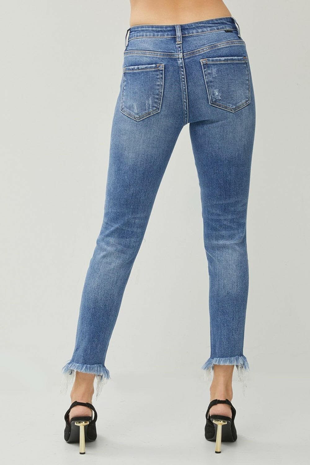 RISEN Distressed Frayed Hem Slim Jeans.