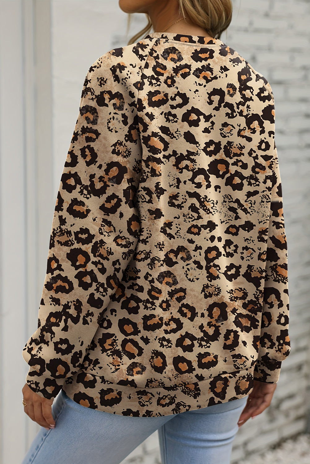 Leopard print pumpkin sweatshirt with a bleached design for Halloween celebrations