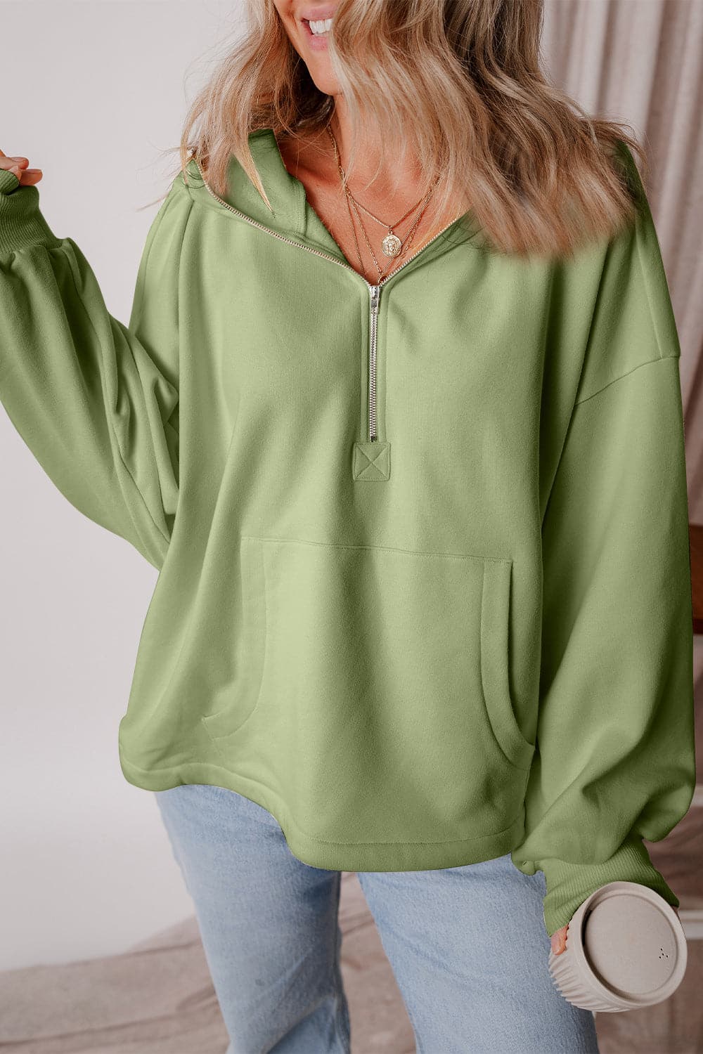 Pocketed Half Zip Dropped Shoulder Hoodie.