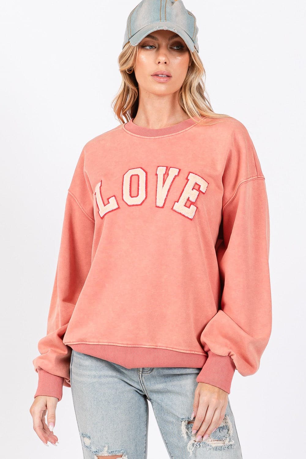 Love-inspired drop shoulder sweatshirt with playful applique details