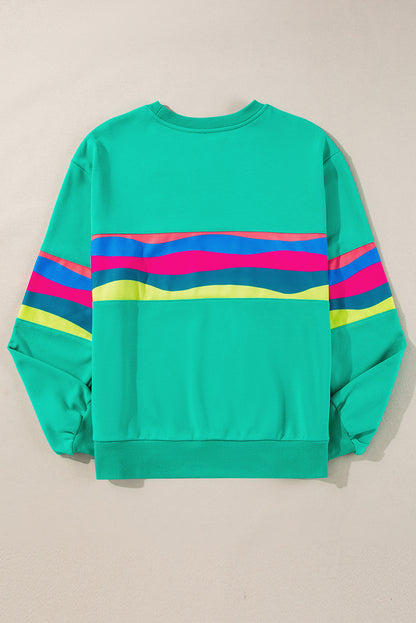 Vibrant green striped long sleeve tee for effortless style