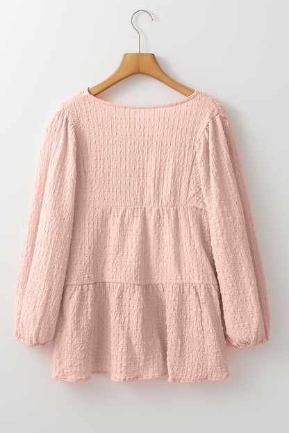 Chic tiered flowy blouse in soft pink texture