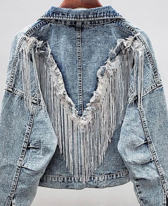 Model wearing Miss Sparkling Fringe Denim Jacket. A stylish, casual look.