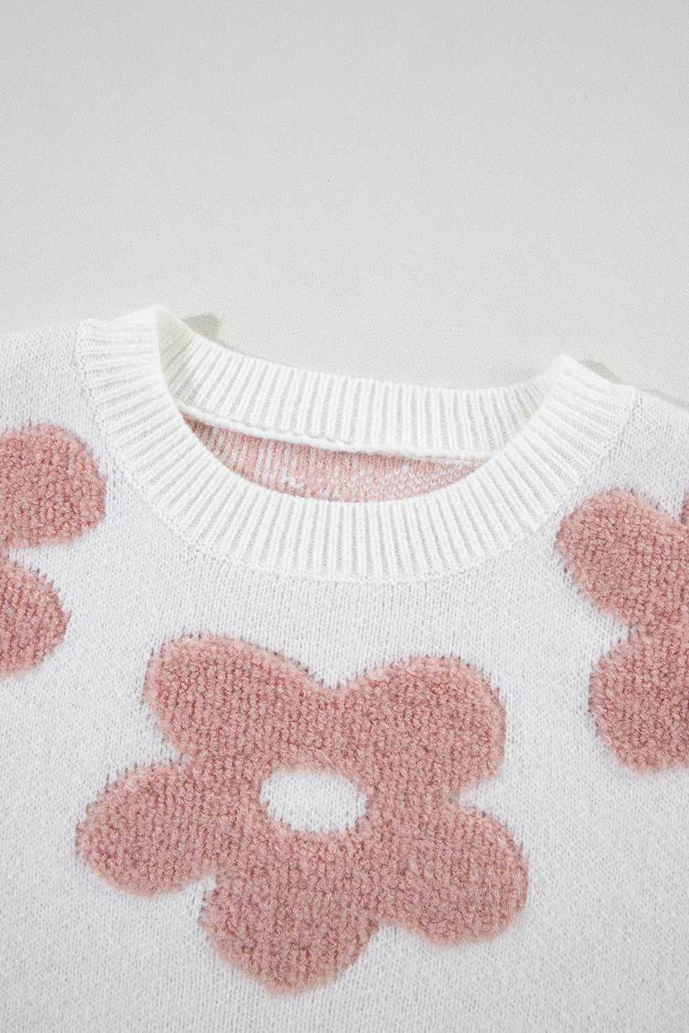 Floral-inspired white drop shoulder sweater for relaxed winter vibes