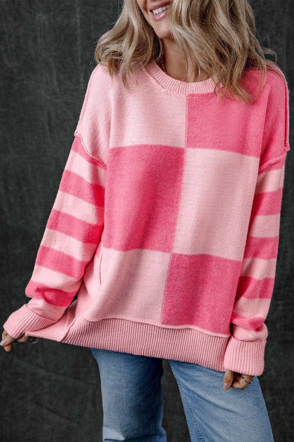 Exposed Seam Round Neck Sweater.