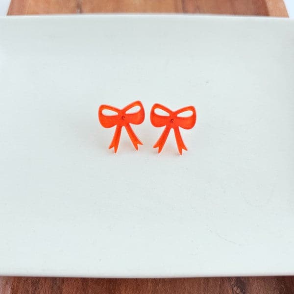 Bow Studs - Orange Glitter.