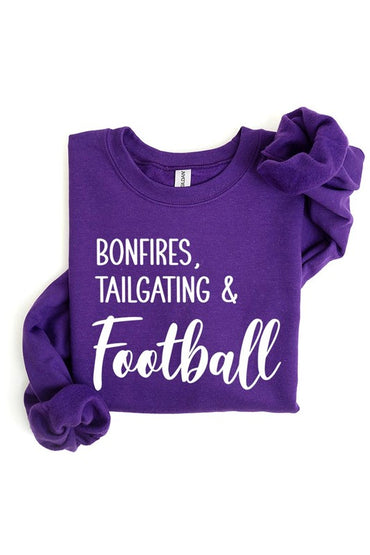 Game day vibes: Bonfires and football graphic sweatshirts